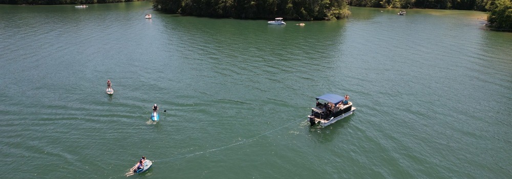 View From Above Crest Tritoon with Paddleboards